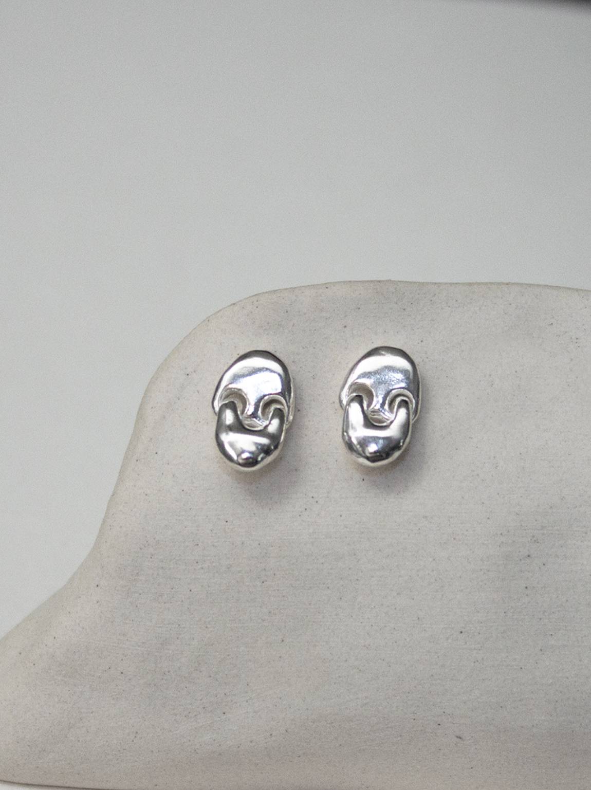 crying creature earrings